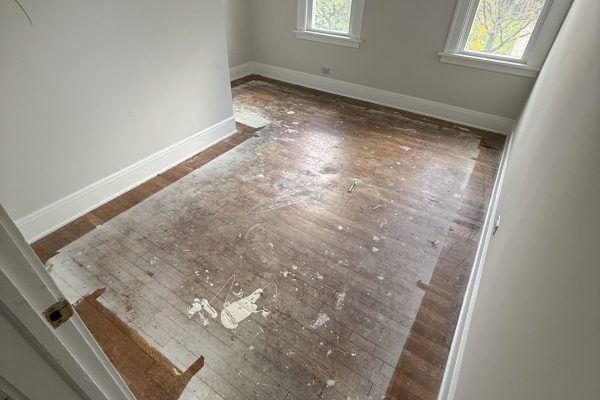 photo shows the before of a recently refinished hardwood floor in cleveland, ohio