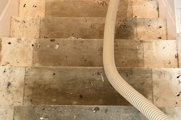 photo shows the before of a recently refinished hardwood floor in cleveland, ohio -- this photo shows the staircase which was covered in paint and refinished by cleveland hardwood restoration