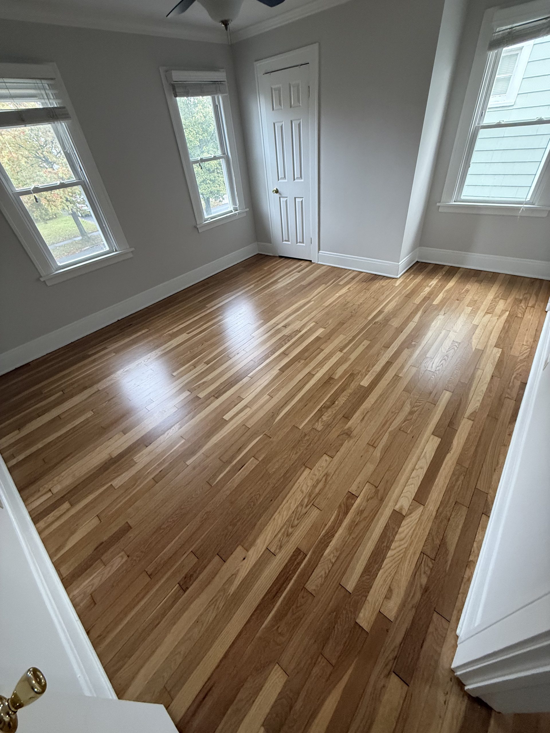 photo shows a refinished hardwood floor in cleveland, ohio -- it's an oak floor in an older home that was completely sanded and finished by cleveland hardwood restoration.